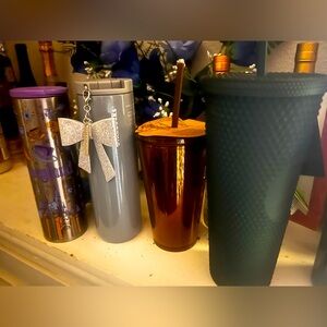 Four Starbucks cups for 50